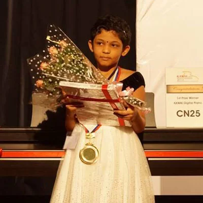 Student with piano award